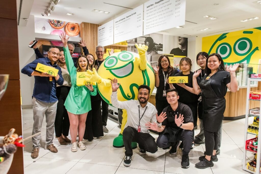 The team at Lee's Donuts cheering the opening.