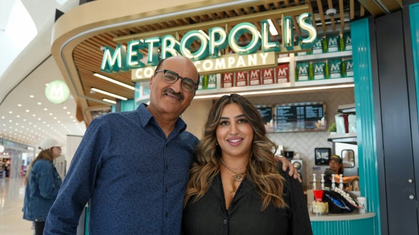 Two owners of Metropolis Coffee company in front of their store during the opening of new stores at Chicago O'Hare International Airport